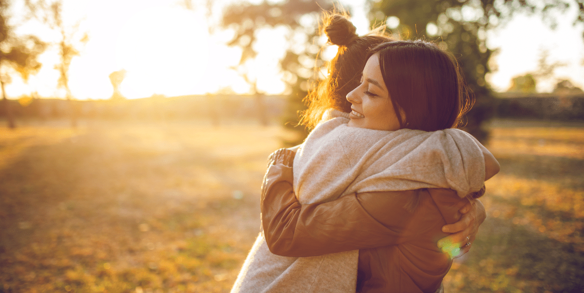 Women hugging providing depression support 