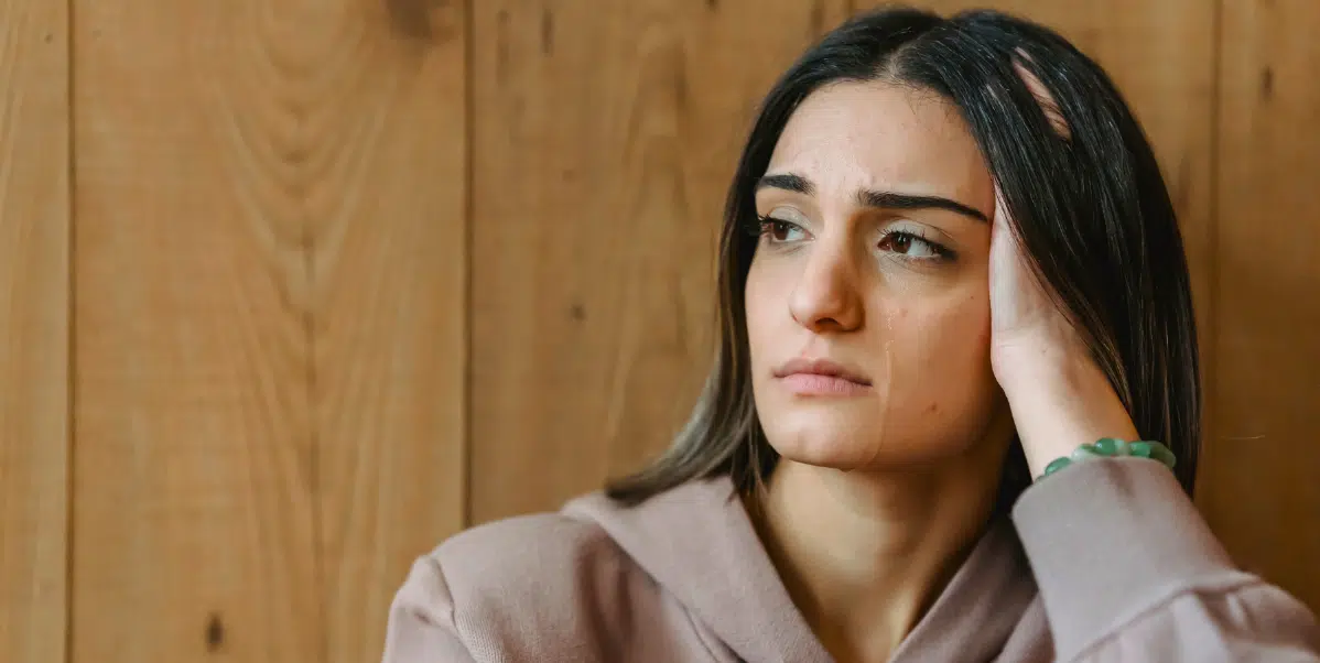 Stages of Depression - Sad woman with hand on her head